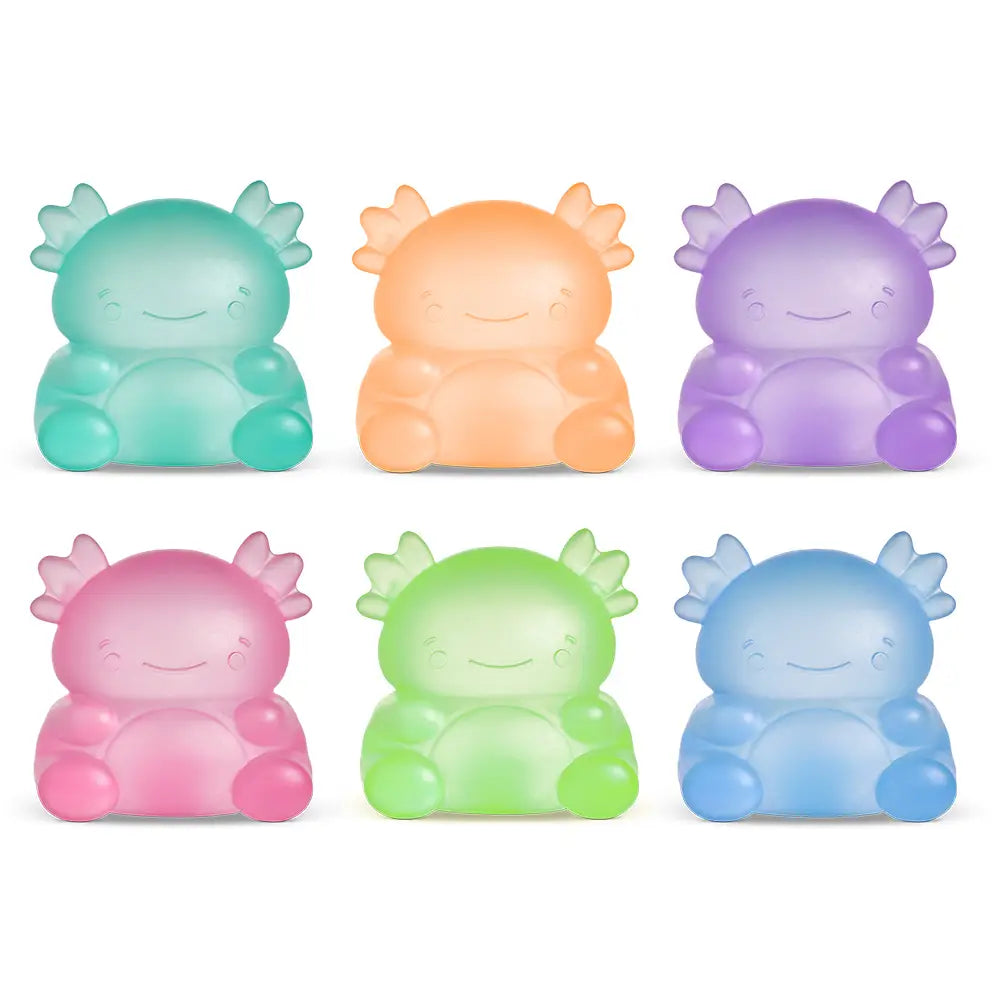 Set of six colorful, cartoon-like creature figurines on a white background