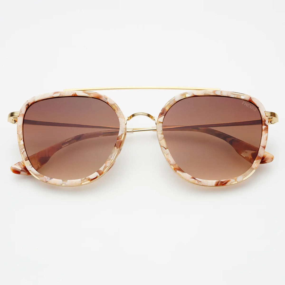 Oversized square sunglasses with a marbled tortoiseshell frame in beige, brown, and cream, gold metal rims and bridge, and brown gradient lenses.