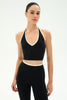 woman modeling a halter neck athletic womens top 