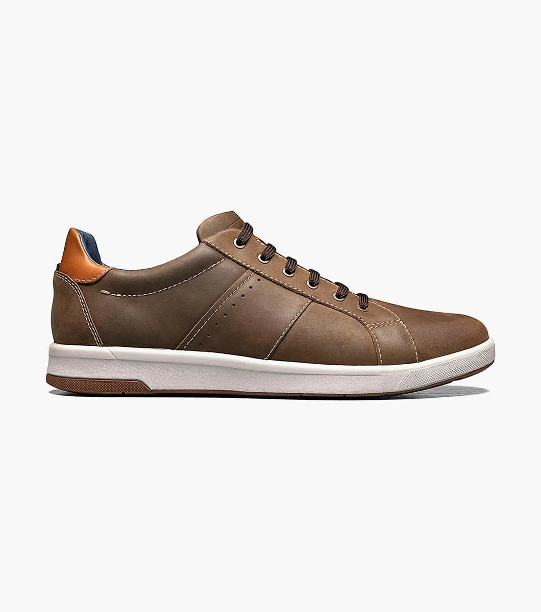 Brown leather sneaker on a white background