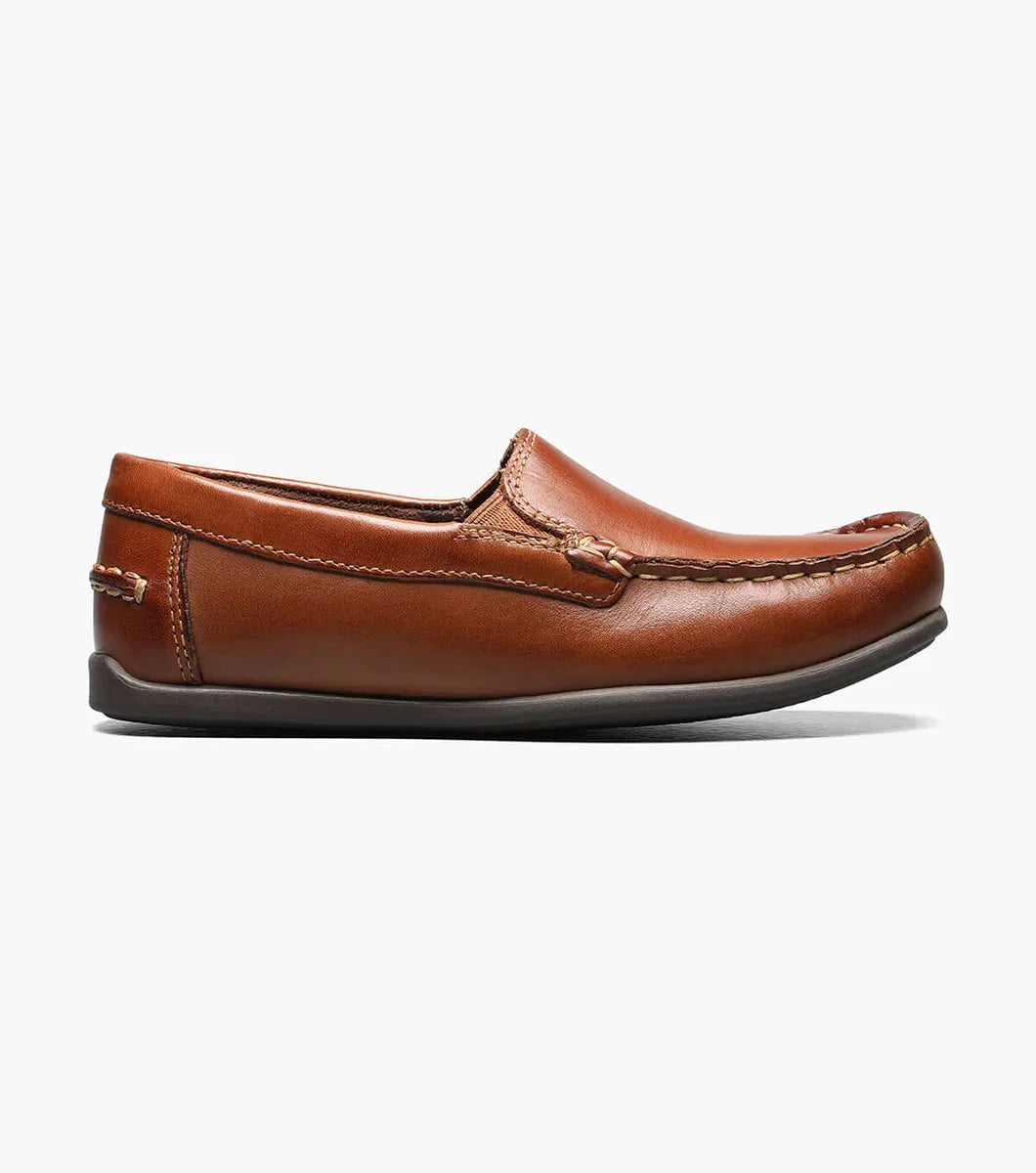 Brown leather loafer shoe on a white background