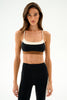 woman modeling a color block bra