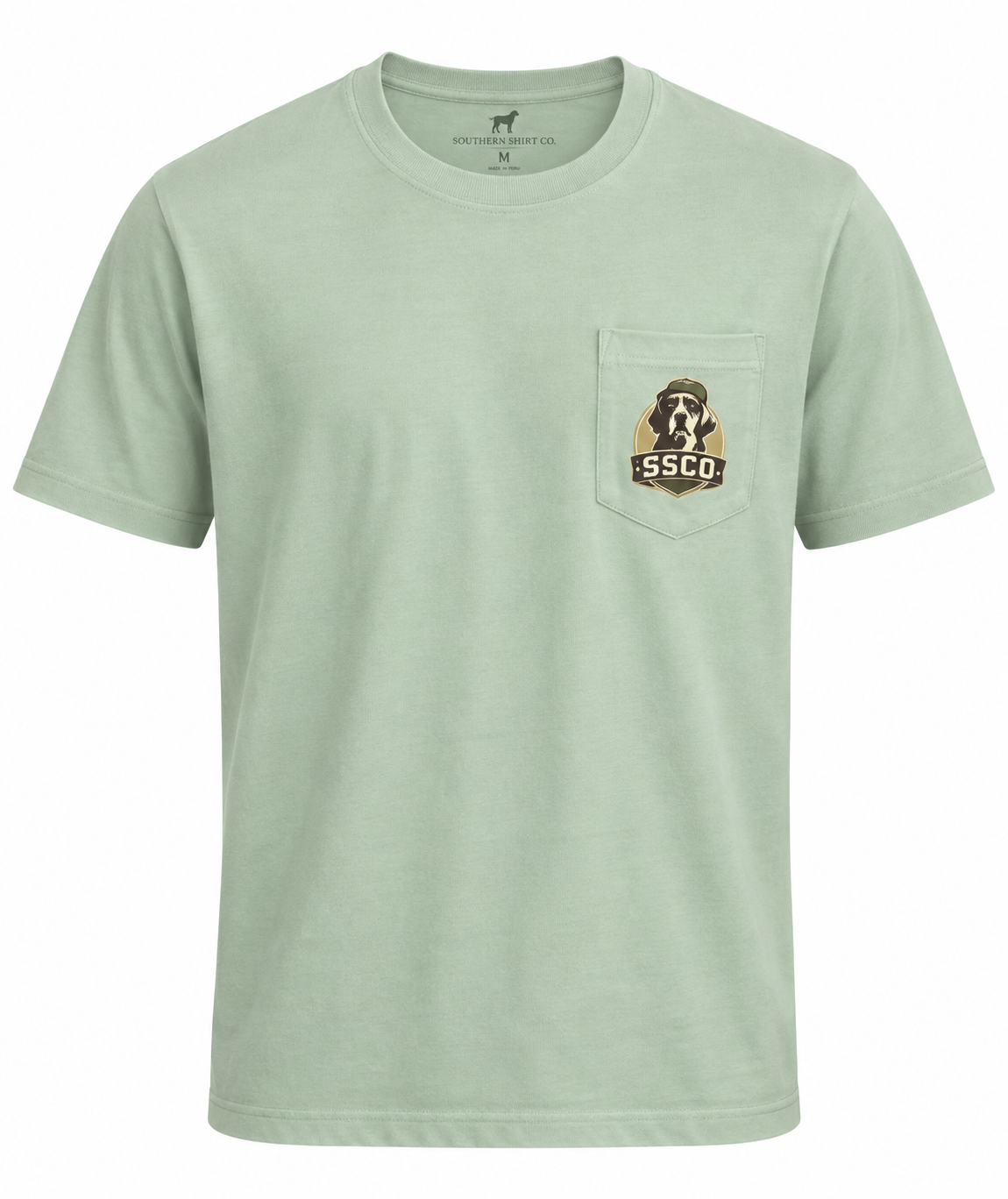 A light sage green short-sleeve crewneck t-shirt with a chest pocket featuring a brown and white dog graphic and the text 'SSCO'.