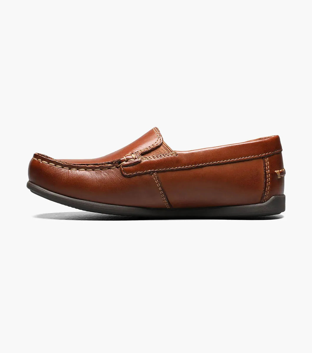 Brown leather loafer shoe on a white background