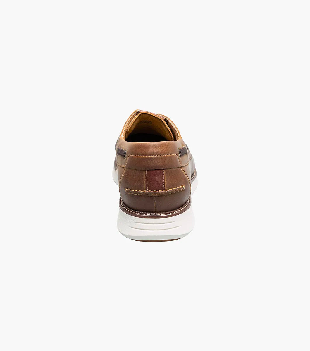 Brown leather shoe on a white background