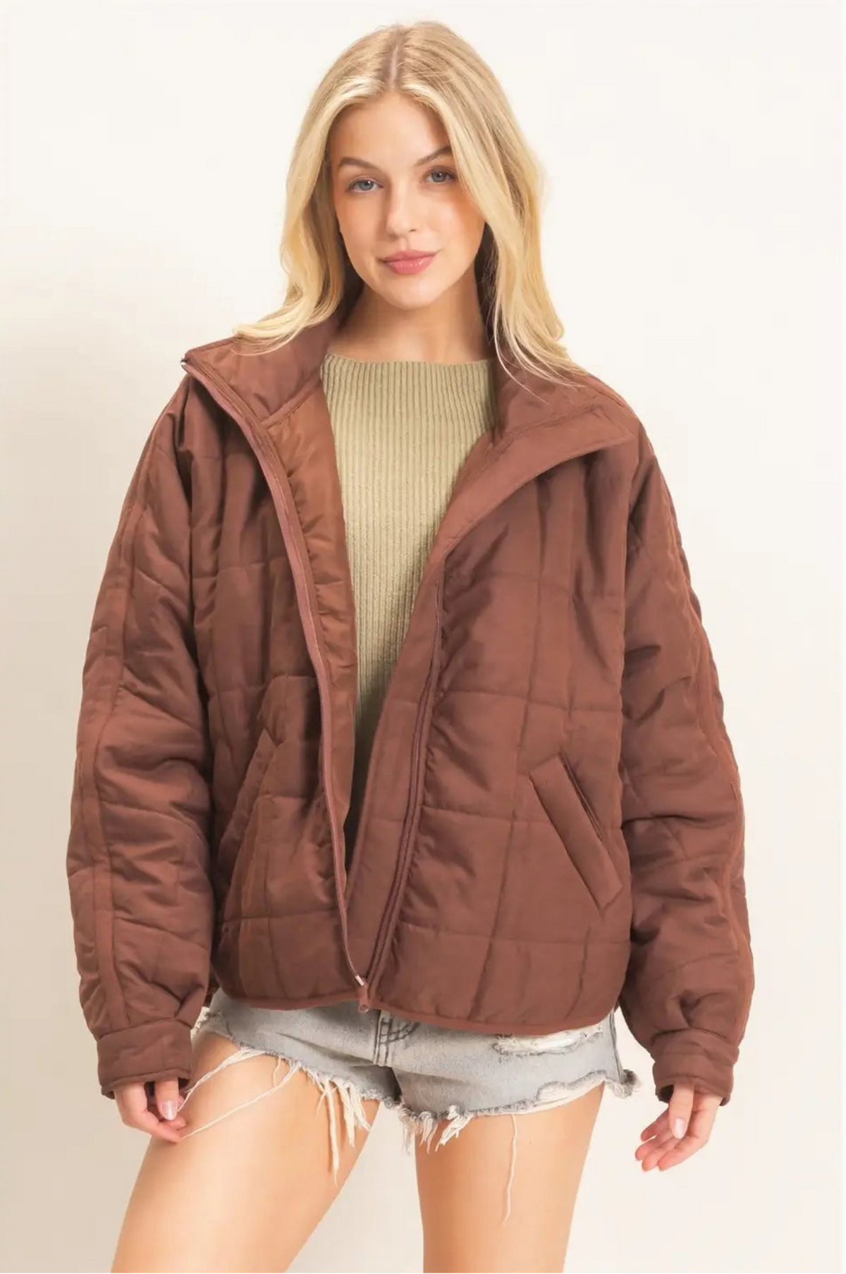 Woman wearing brown quilted jacket