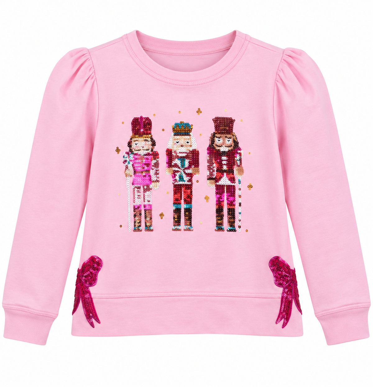 A pink long-sleeve sweatshirt for girls, featuring a sequined graphic of three nutcracker figures on the chest and matching pink sequined bow details on the lower sleeves, set against a plain white background.