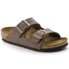 Brown Birkenstock sandal with gold buckle on a white background