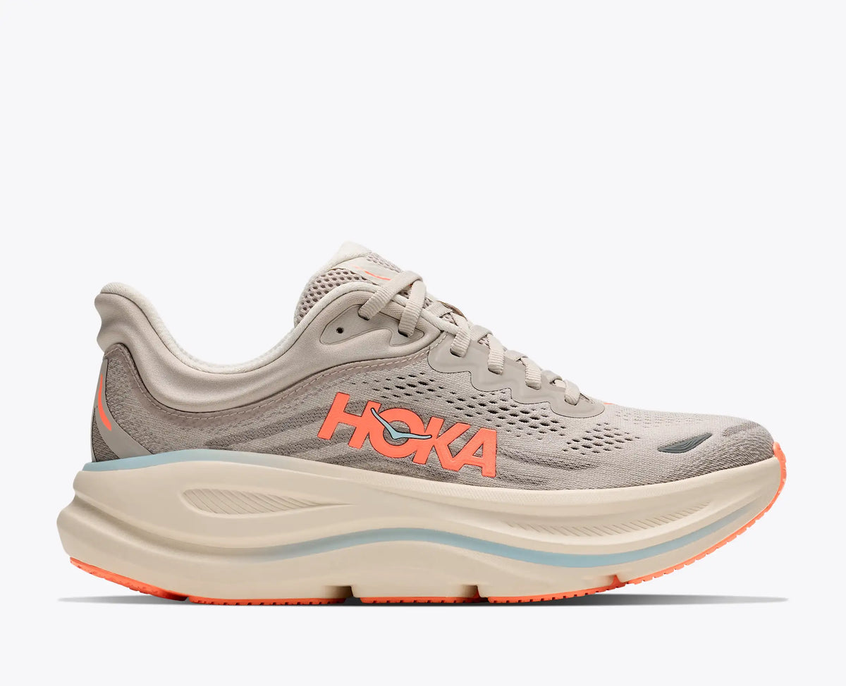 brown grey hoka sneaker with orange accents