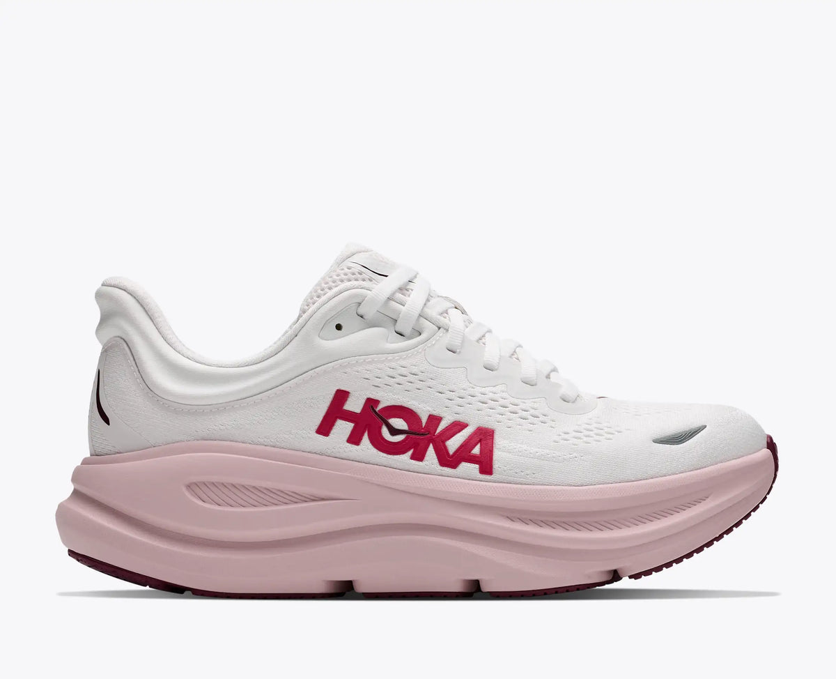 white hoka sneaker with pink sole