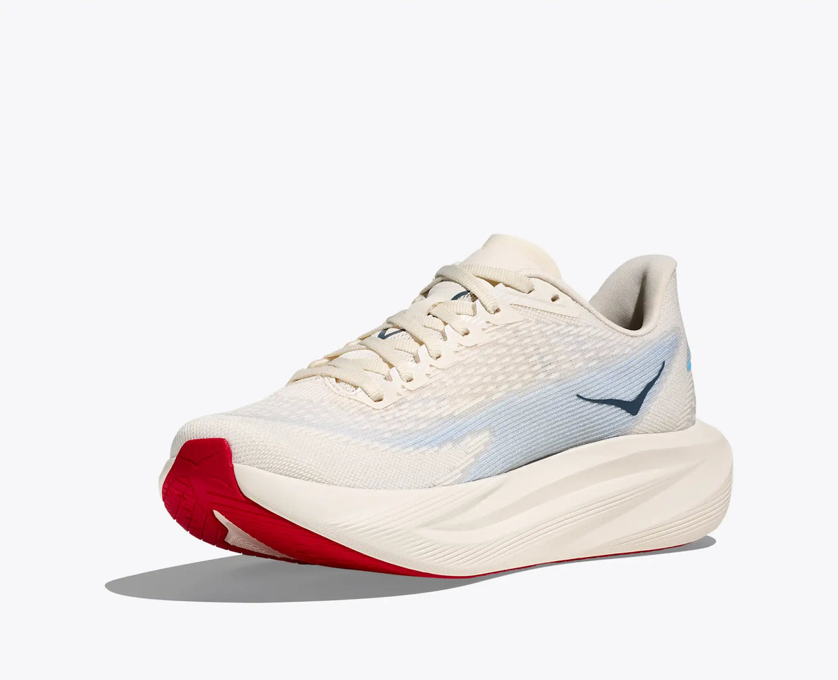 White running shoe with red sole on a white background