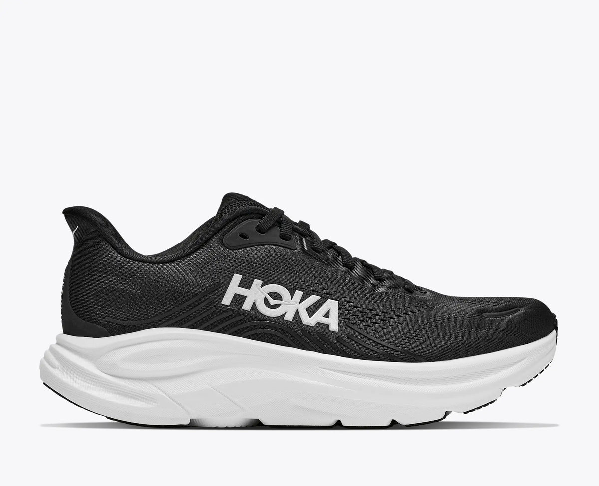Black running shoe with white accents on a white background