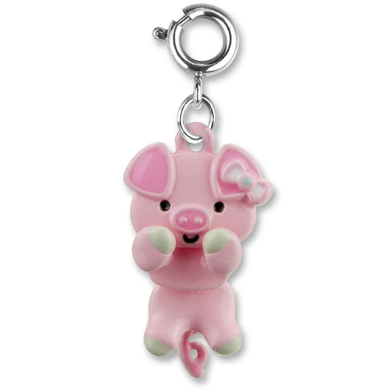 Pink pig charm with a white background