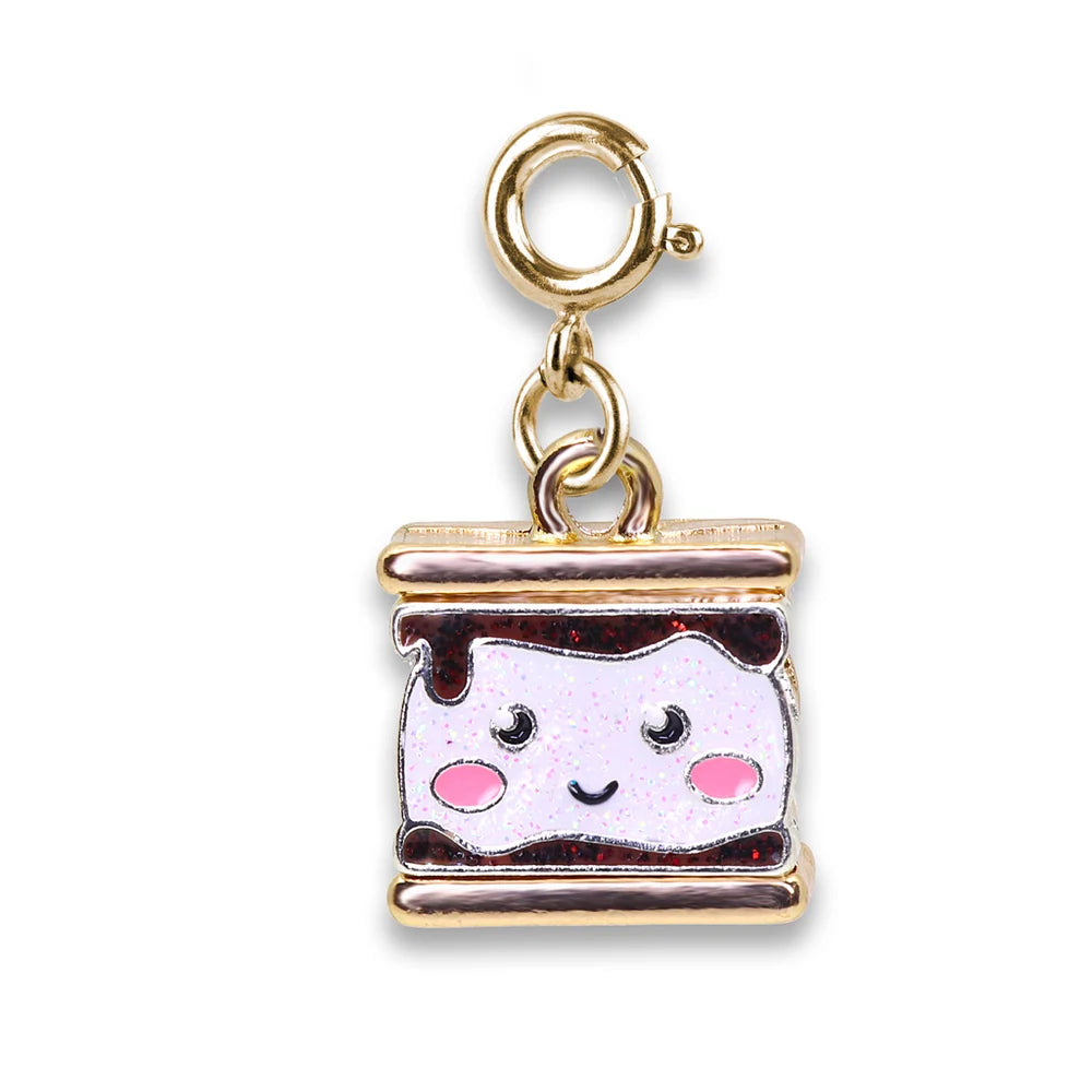 Gold charm shaped like a cute marshmallow sandwich with pink cheeks on a white background