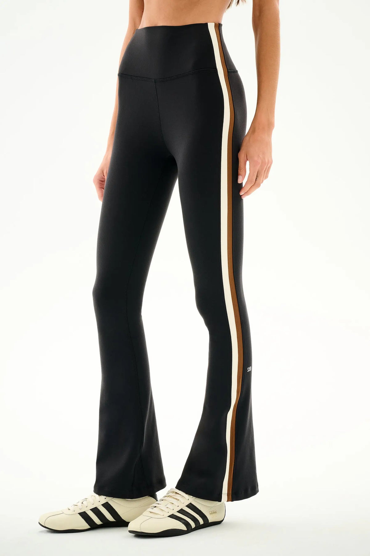 woman modeling yoga pants on a white background