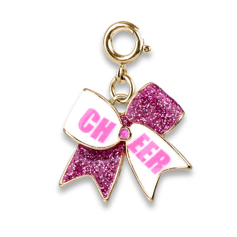 A cheer bow charm with a gold-tone clasp, featuring a glittery pink bow with white ribbon tails and the word 'CHEER' in pink on one of the tails.