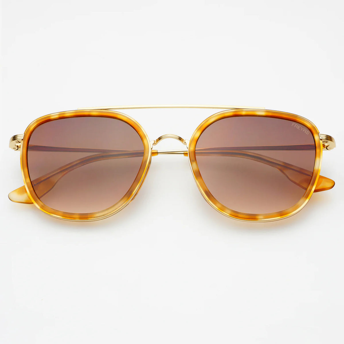 Sunglasses with light tortoiseshell frame and gold accents on a white background