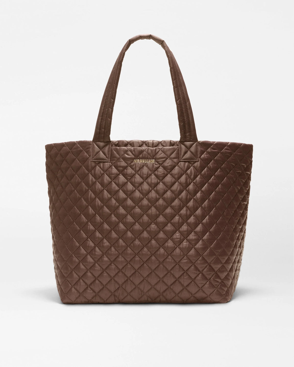 A brown quilted leather tote bag with double shoulder straps, shown against a plain light gray background.