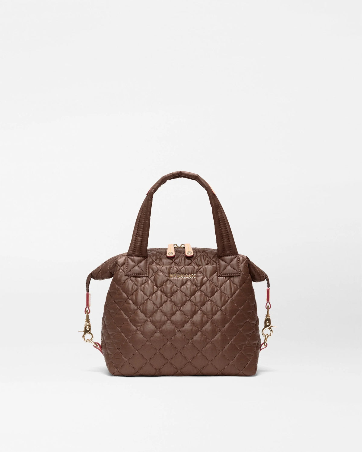A brown quilted leather handbag with top handles and a detachable shoulder strap, shown against a plain white background.