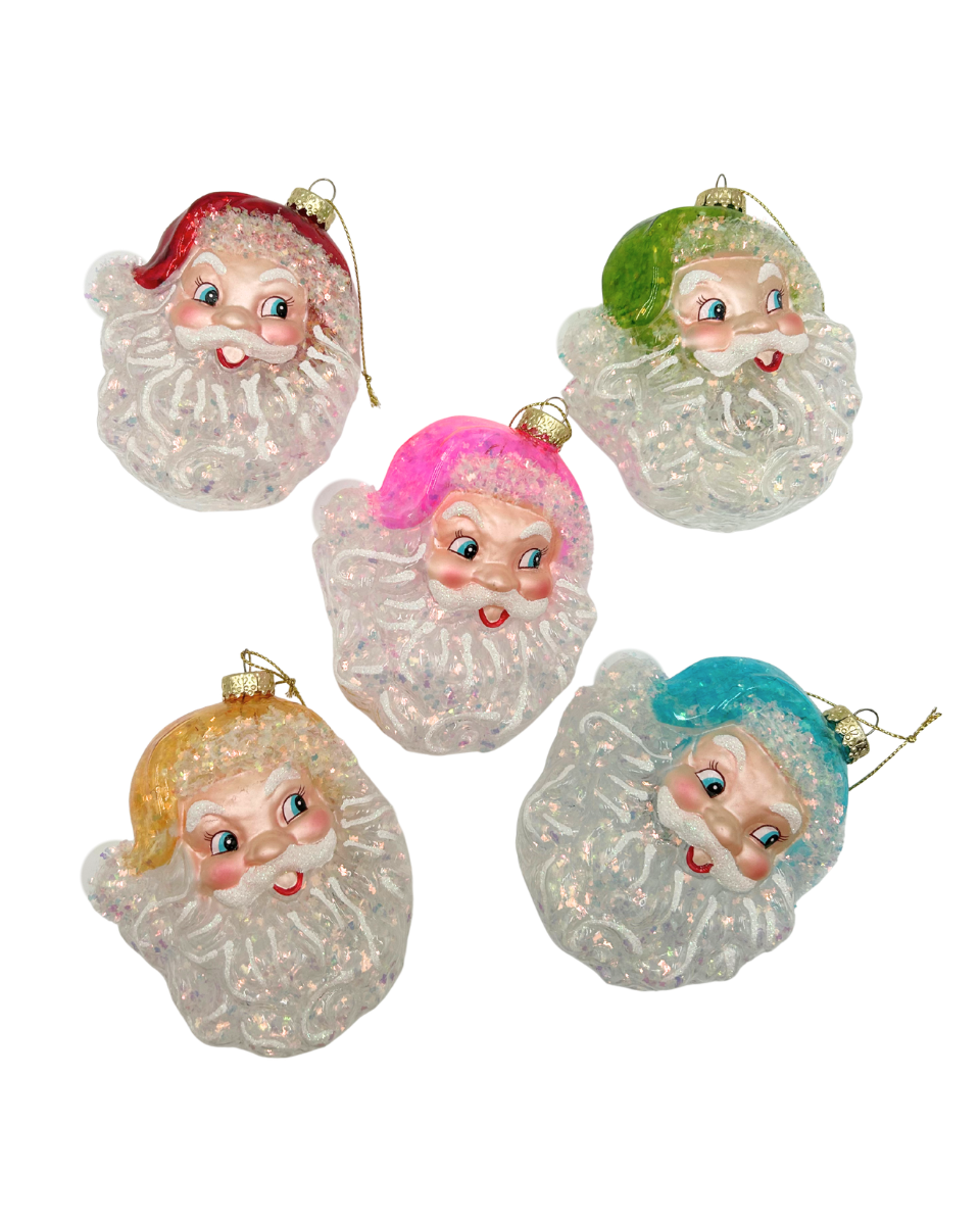 Five vintage-style glittery Santa Claus ornaments in different colored hats (red, green, pink, yellow, and blue) with white glittery beards, arranged on a plain white background.