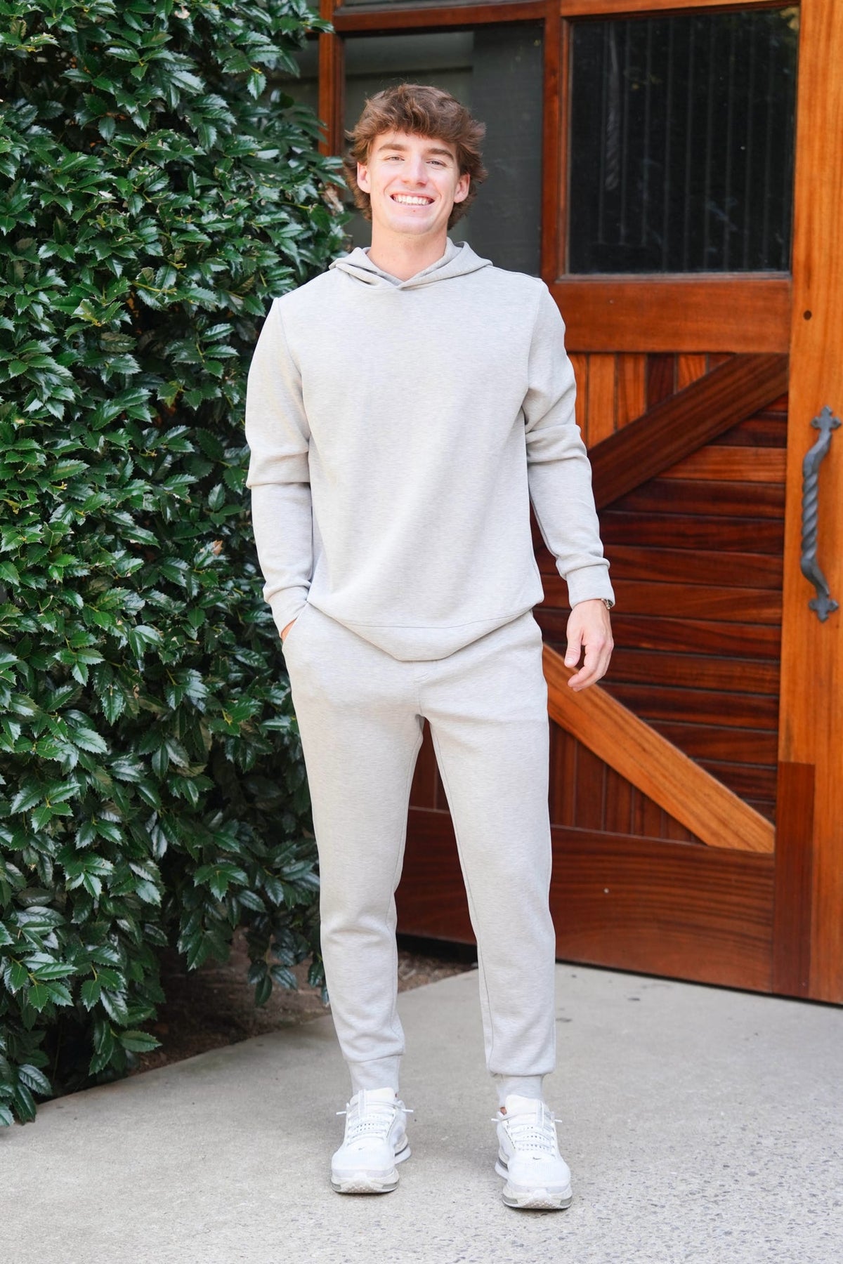 Man modeling a light grey sweat set