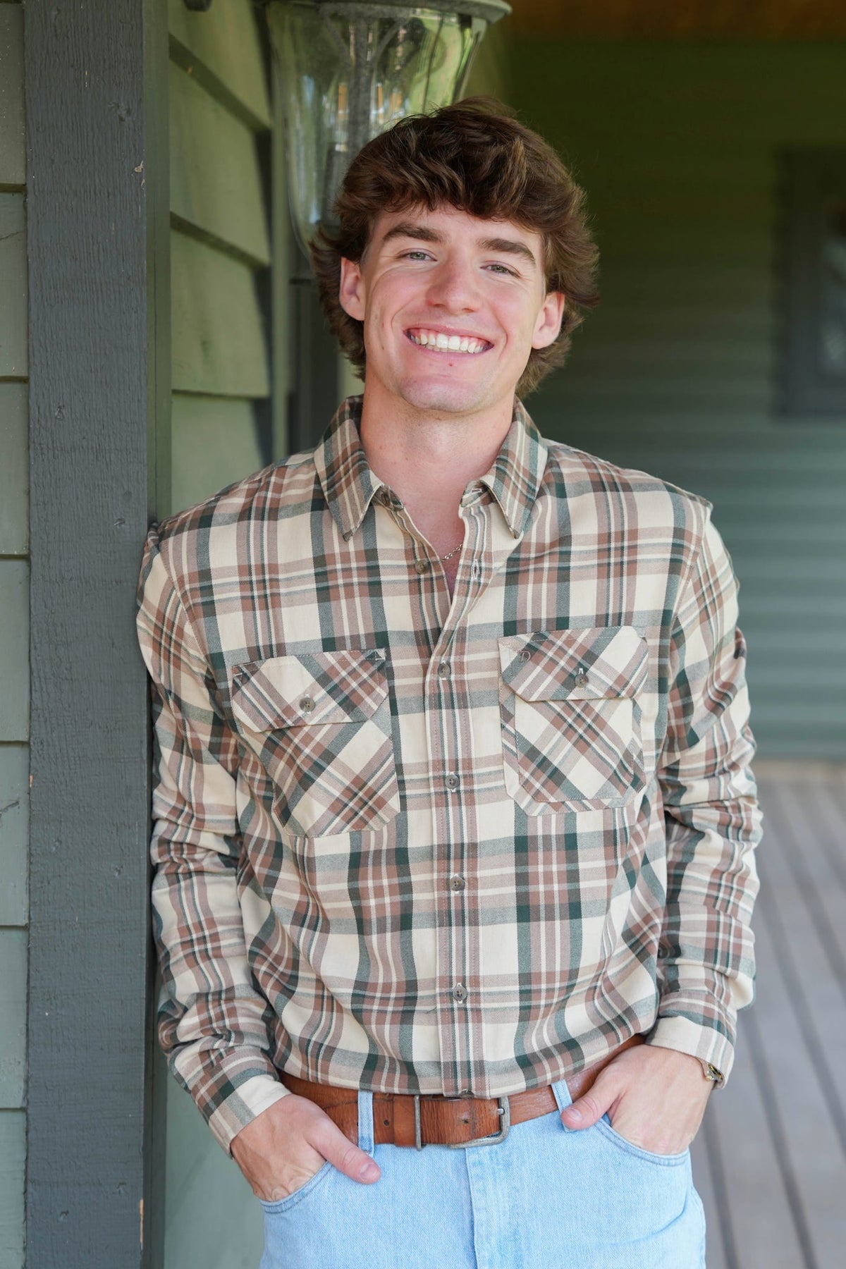 man modeling button down flannel