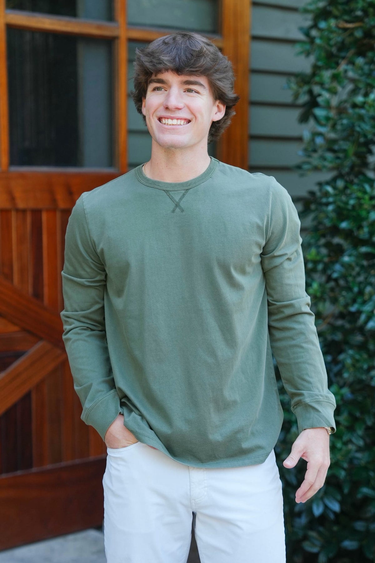 man modeling a long sleeve green t shirt 