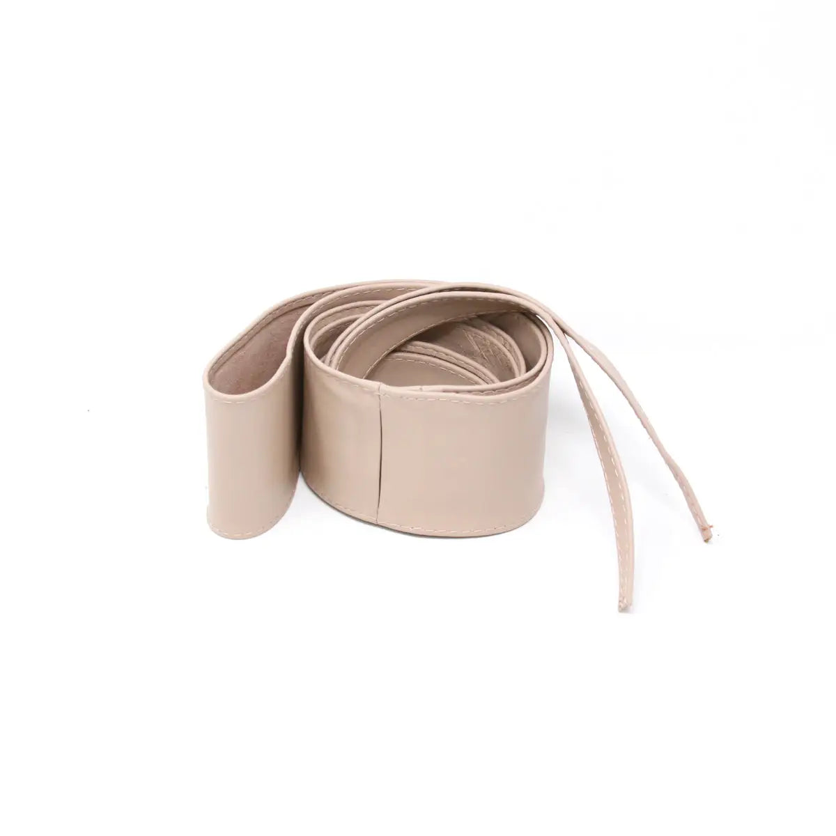A wide, flat beige leather belt coiled on a white background.