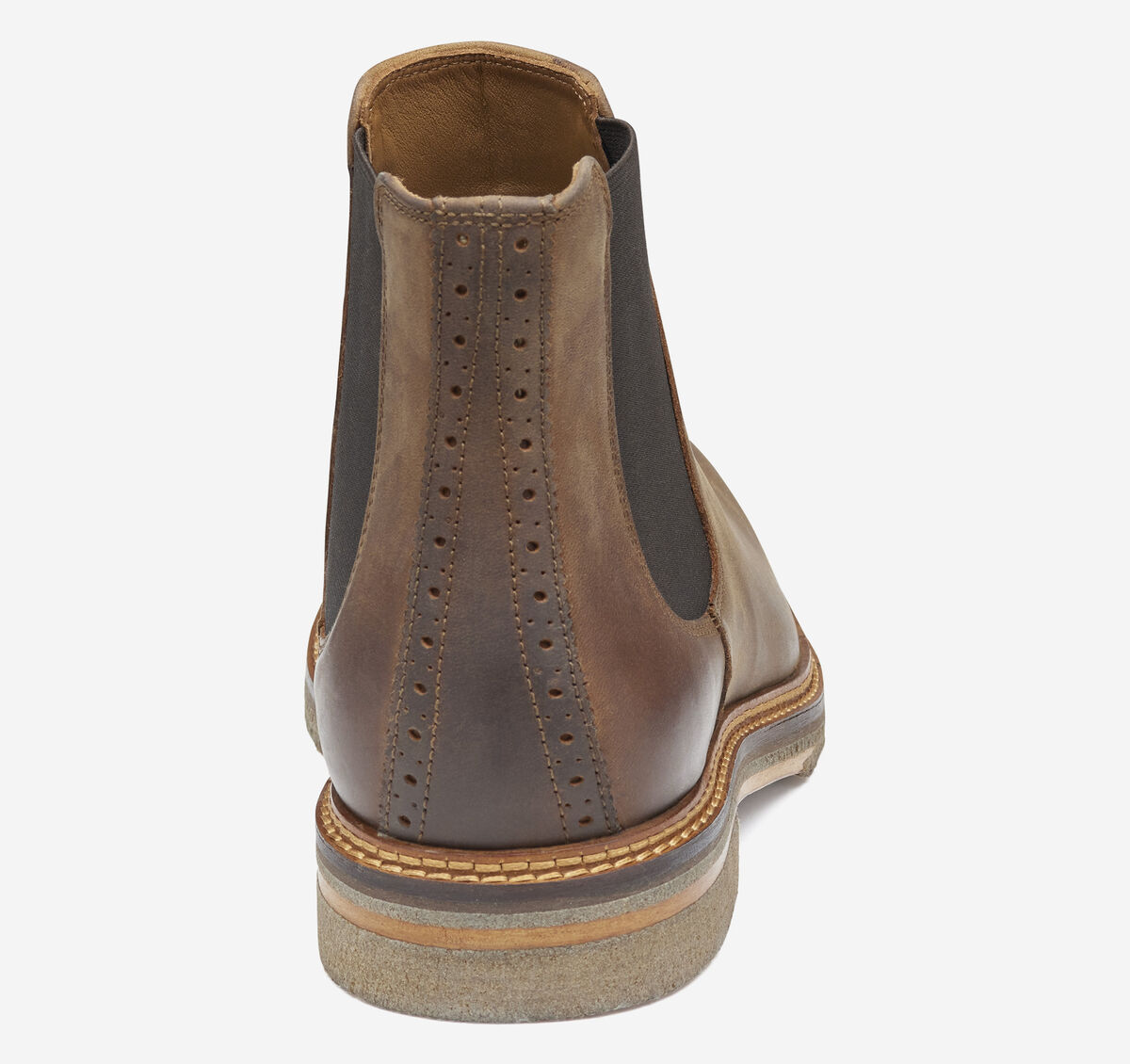 Brown leather Chelsea boot on a white background