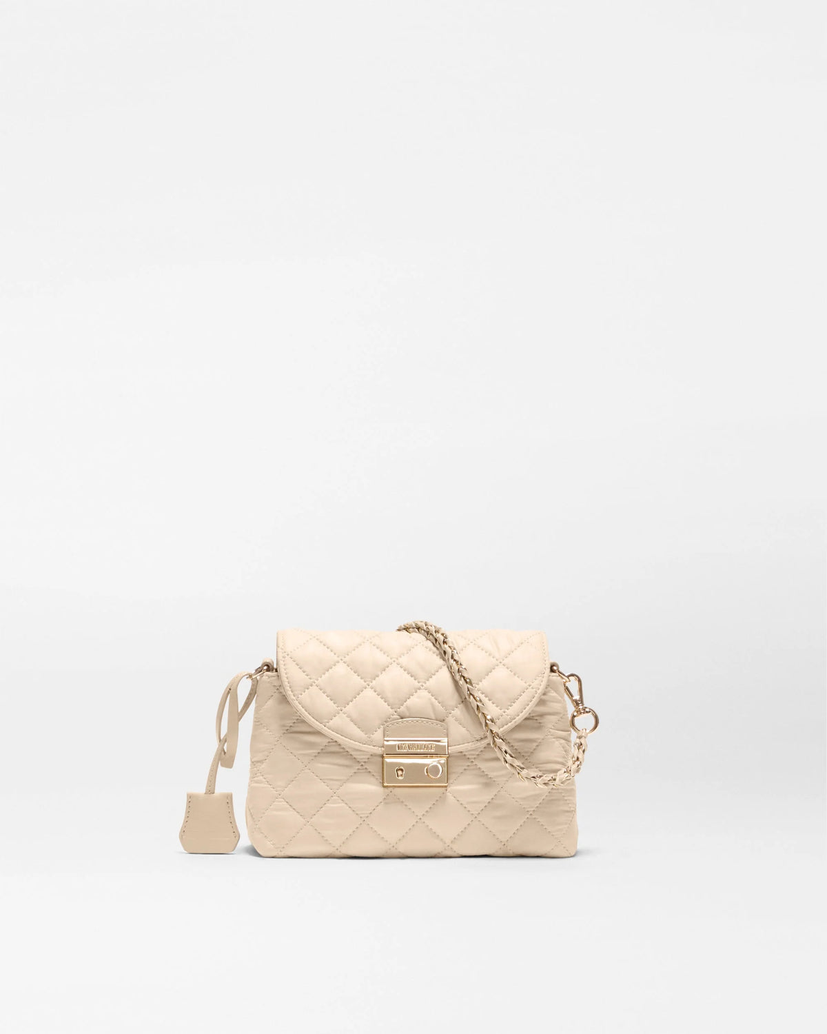 A light beige quilted leather handbag with a gold-tone chain strap and a small gold brand plaque on the front flap, set against a plain white background.