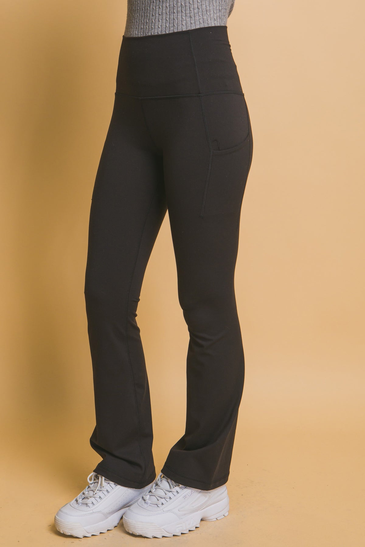 woman modeling black yoga pants
