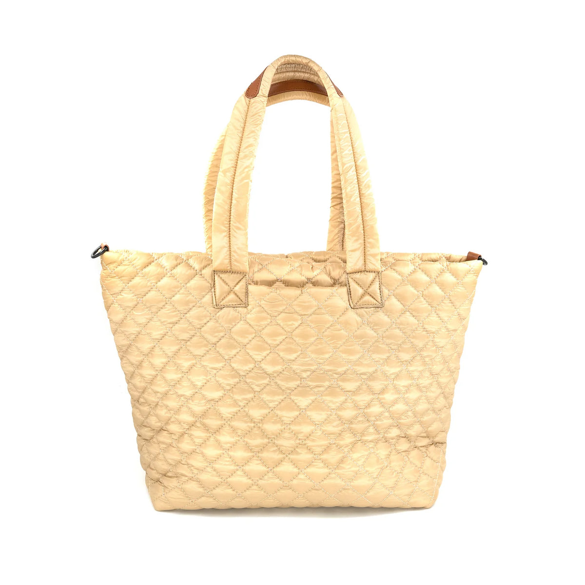 A light beige quilted leather tote bag with double top handles, shown against a plain white background.