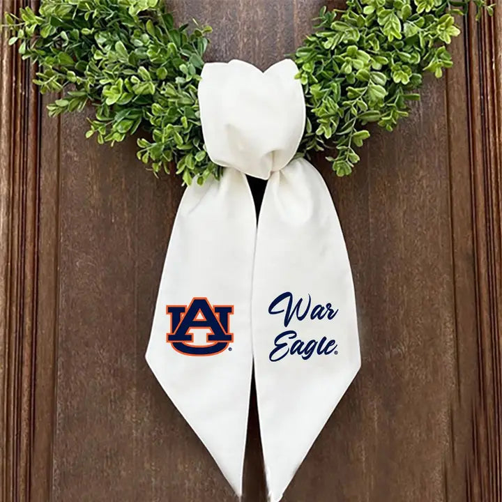 wreath on door showing off a sash that has auburns logo 