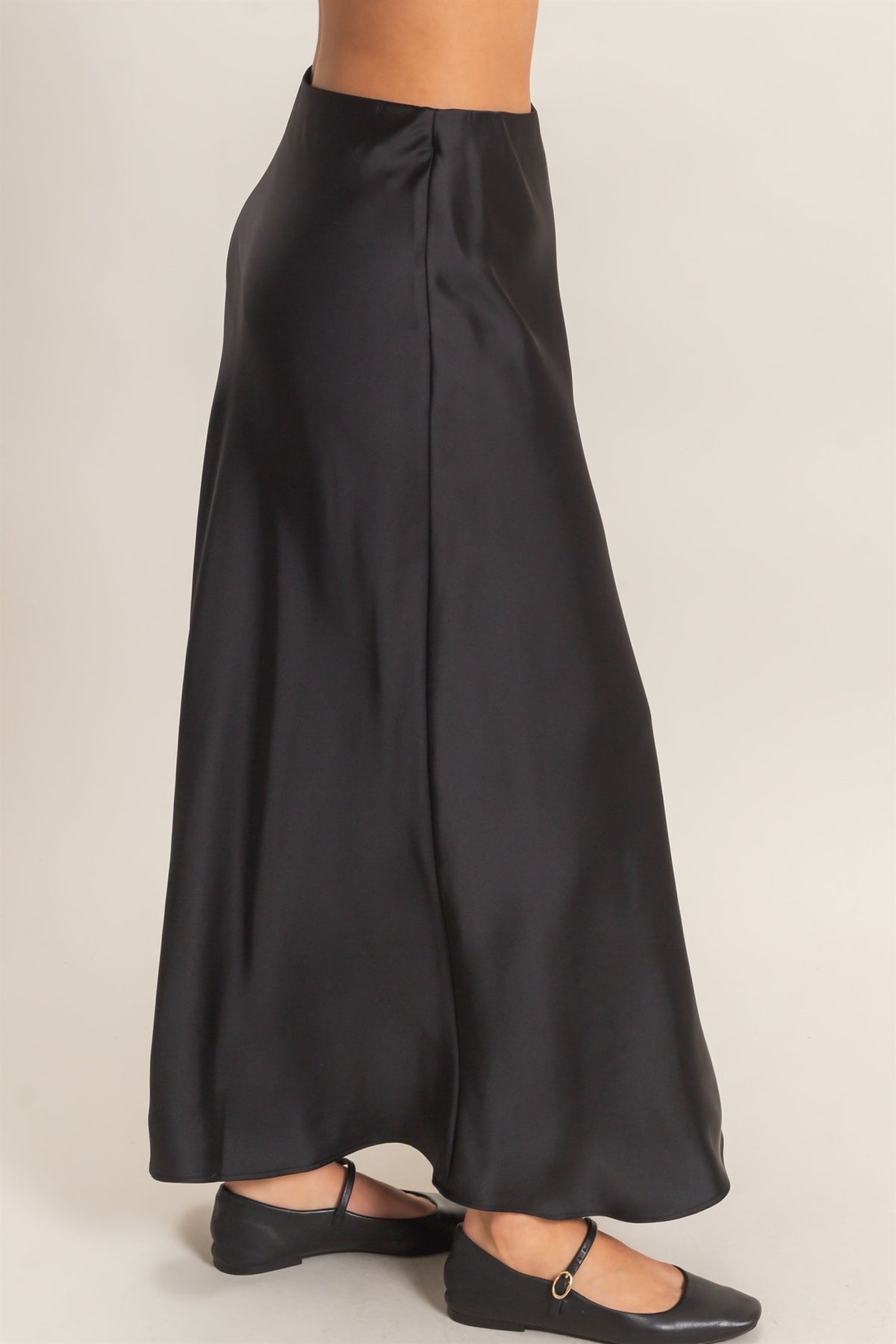 Black wide-leg pants worn by a person on a plain background