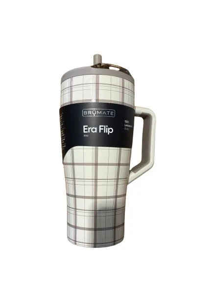 A Brumate Era Flip travel tumbler in a gray and white plaid pattern, featuring a black wrap label with the product name and a gray handle, set against a plain white background.