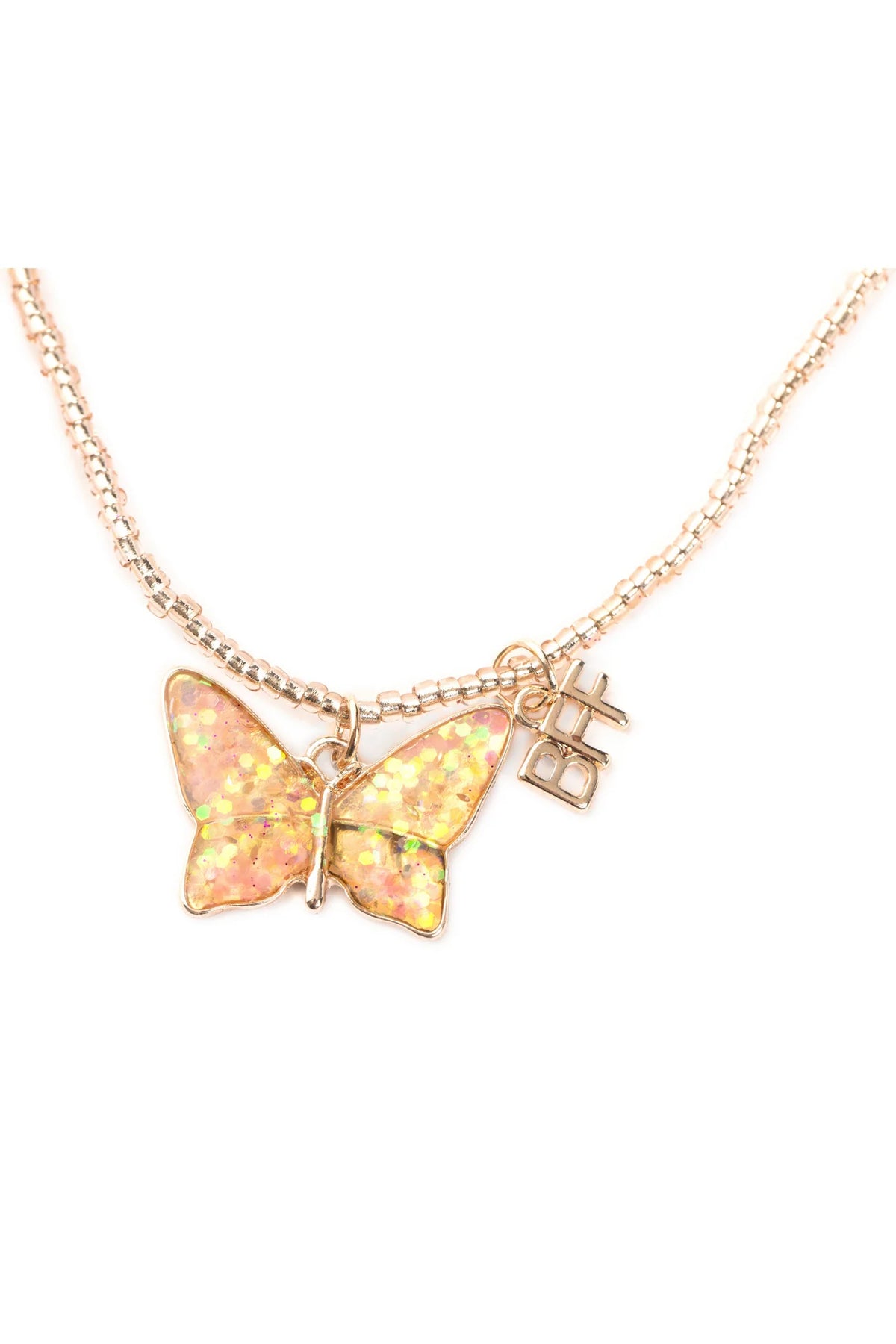 Close up of a gold beaded necklace with a pink and yellow butterfly pendant and 'BFF' charm on a white background.