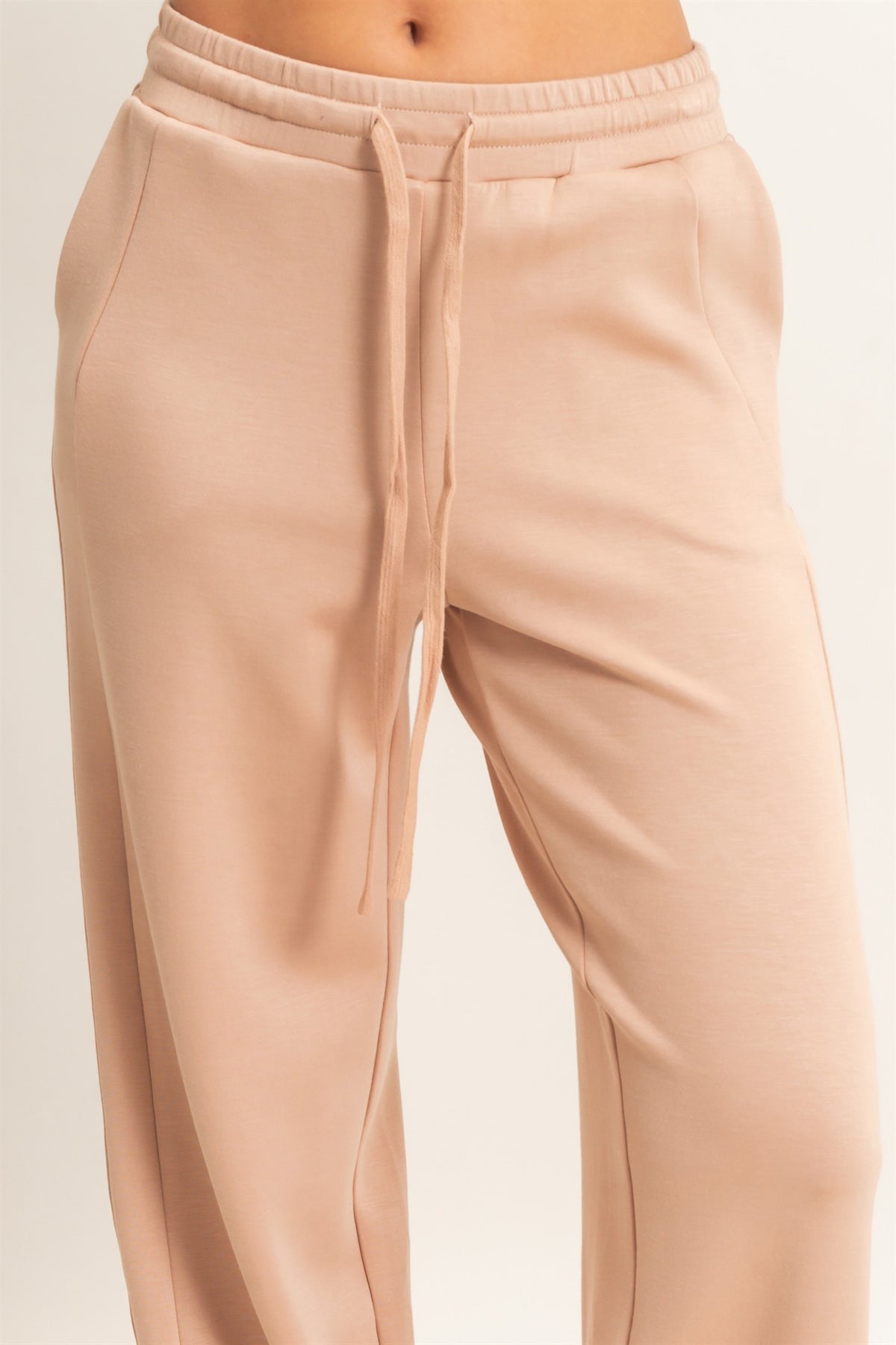 close up of waistband of cream women's loung pants 
