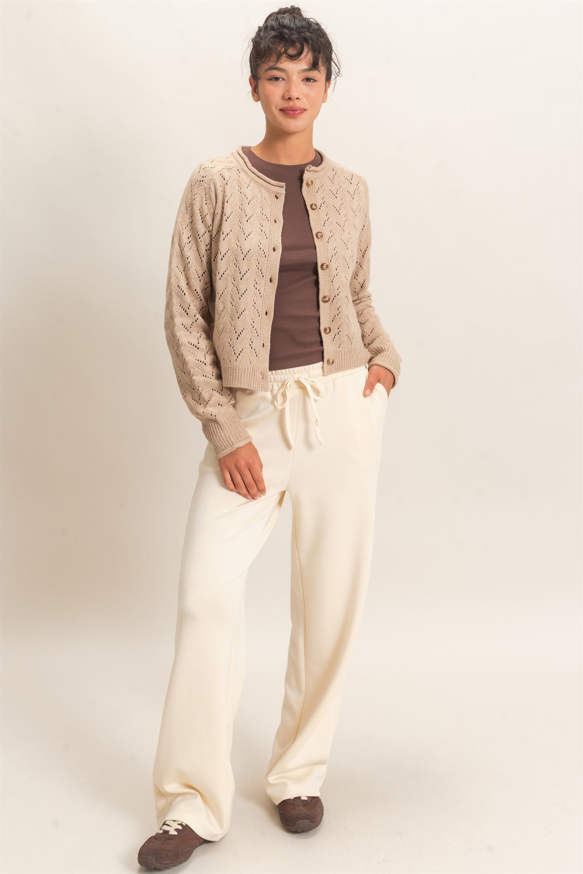 woman modeling lounge pants with brown shirt and taupe cardigan