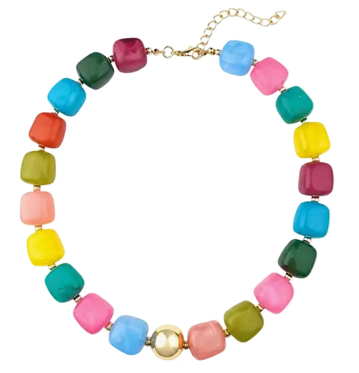 A multicolor beaded necklace with chunky, rounded square beads in various bright colors including pink, blue, green, yellow, orange, and purple, accented by a central gold bead and gold chain clasp, shown on a plain white background.