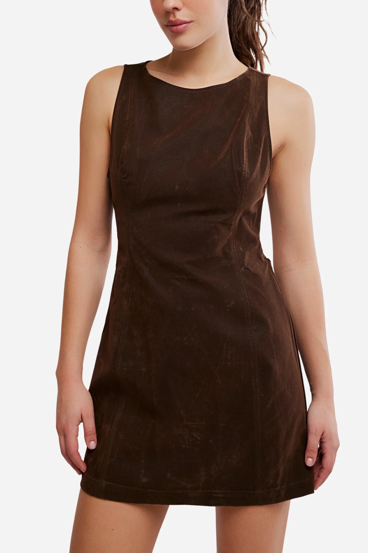 Woman in a brown dress with a white background