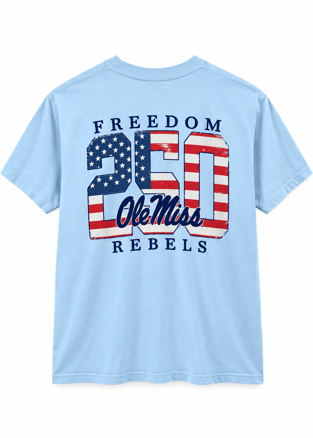 A light blue short-sleeve t-shirt shown from the back, featuring a large graphic print with the words 'FREEDOM 250 Ole Miss REBELS' in navy blue, red, and white, styled with an American flag pattern.