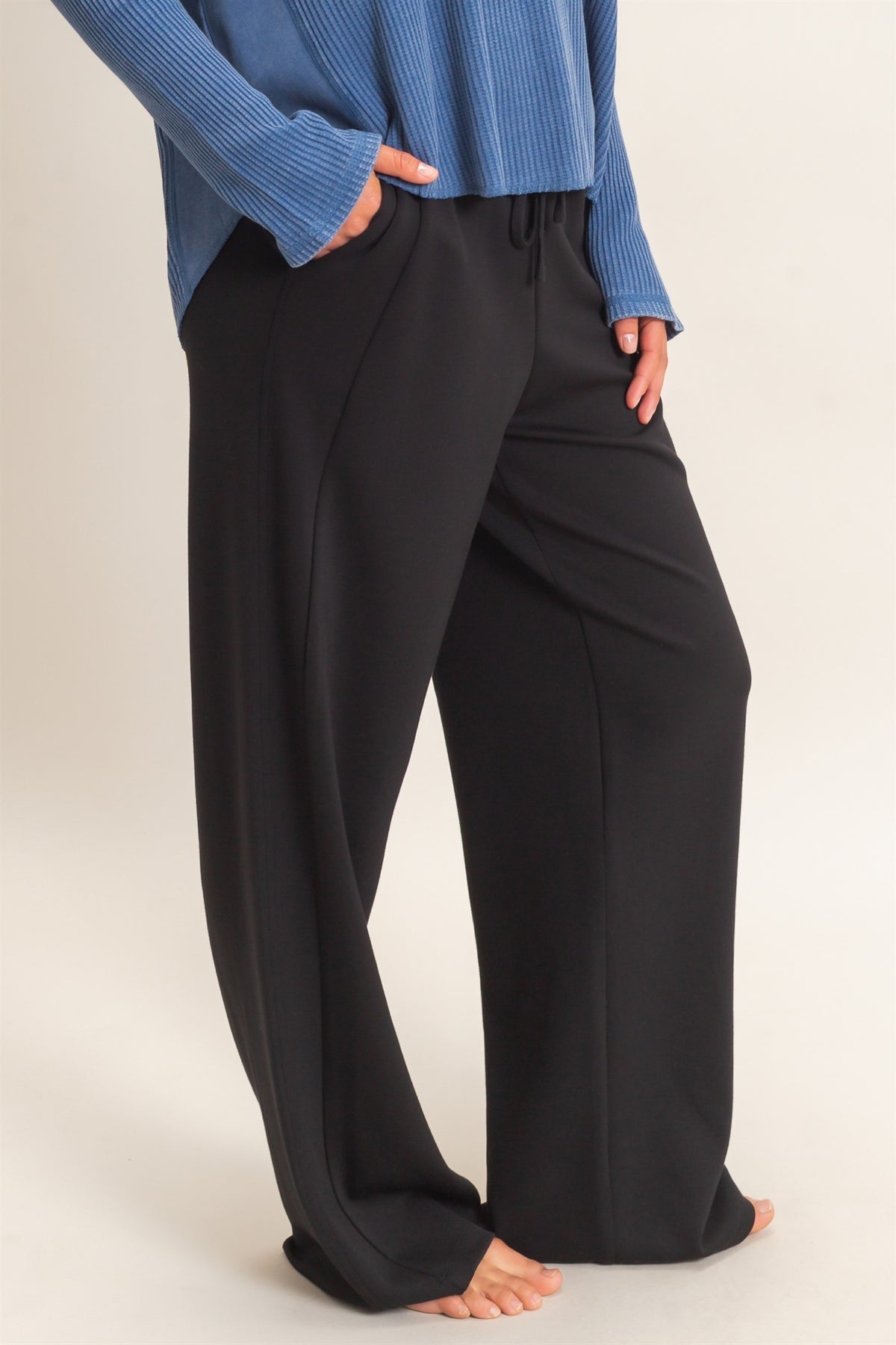 woman modeling lounge straight leg pants and blue waffle knit top 