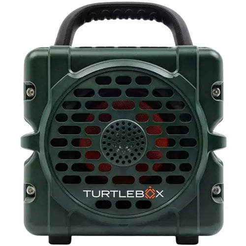 A dark green portable speaker with a black carrying handle, featuring a front grille and the Turtlebox logo printed in white and orange on the lower front.
