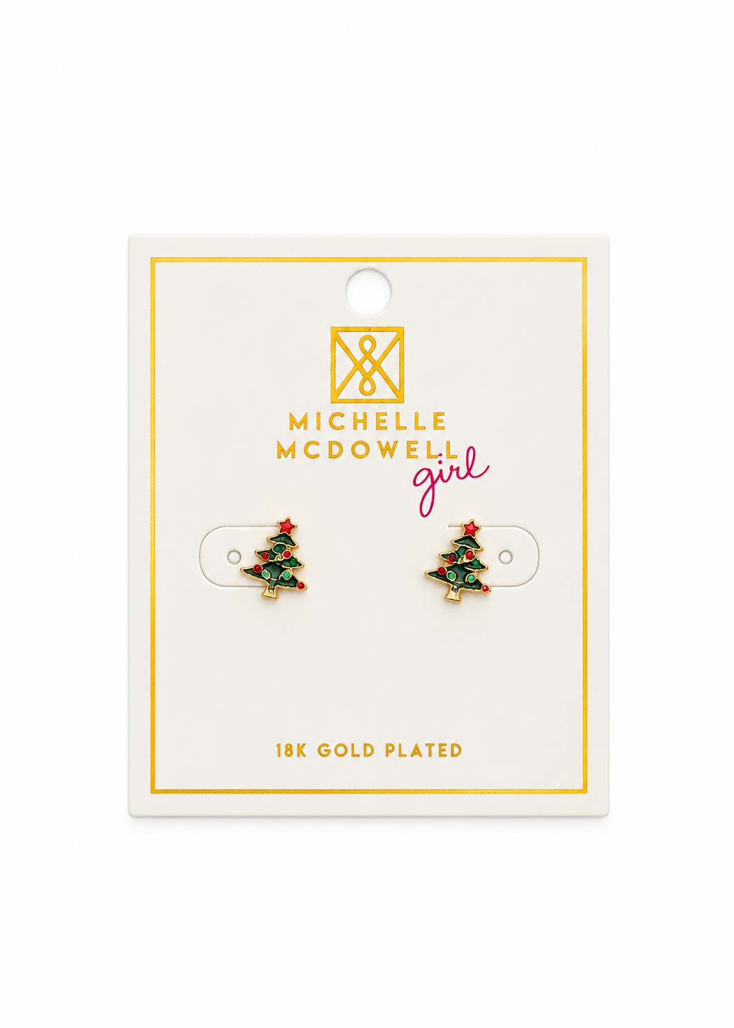 A pair of small Christmas tree stud earrings displayed on a white jewelry card. The card shows the brand name Michelle McDowell girl and text reading 18K GOLD PLATED.