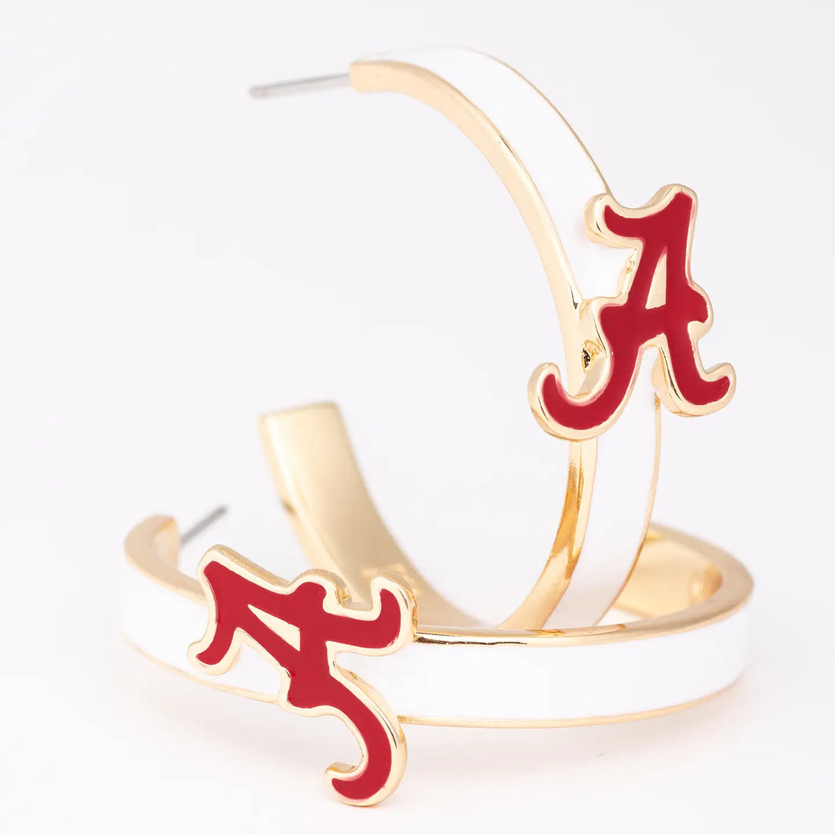 Gold and red earrings with 'A' logo on a white background