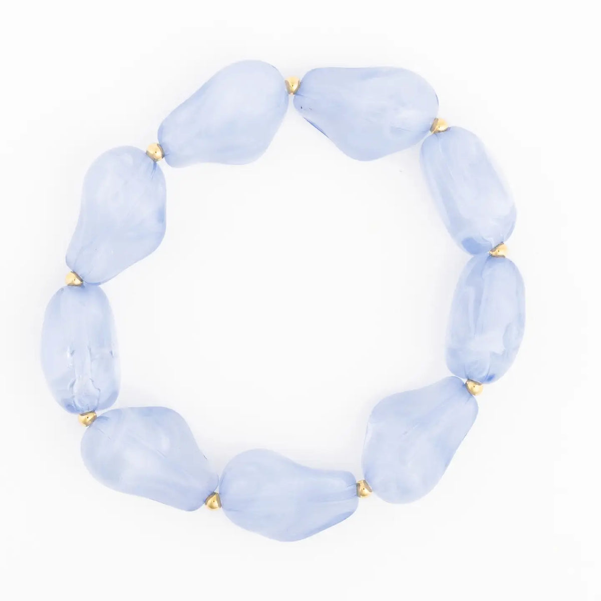 A beaded stretch bracelet made of light blue, irregularly shaped stone-like beads separated by small gold spacer rings, shown on a plain white background.