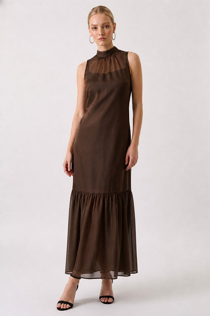 Woman wearing a brown dress on a white background