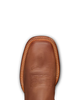 A close-up top-down view of a brown leather boot toe showing the vamp, decorative stitching, and contrast welt on a white background.