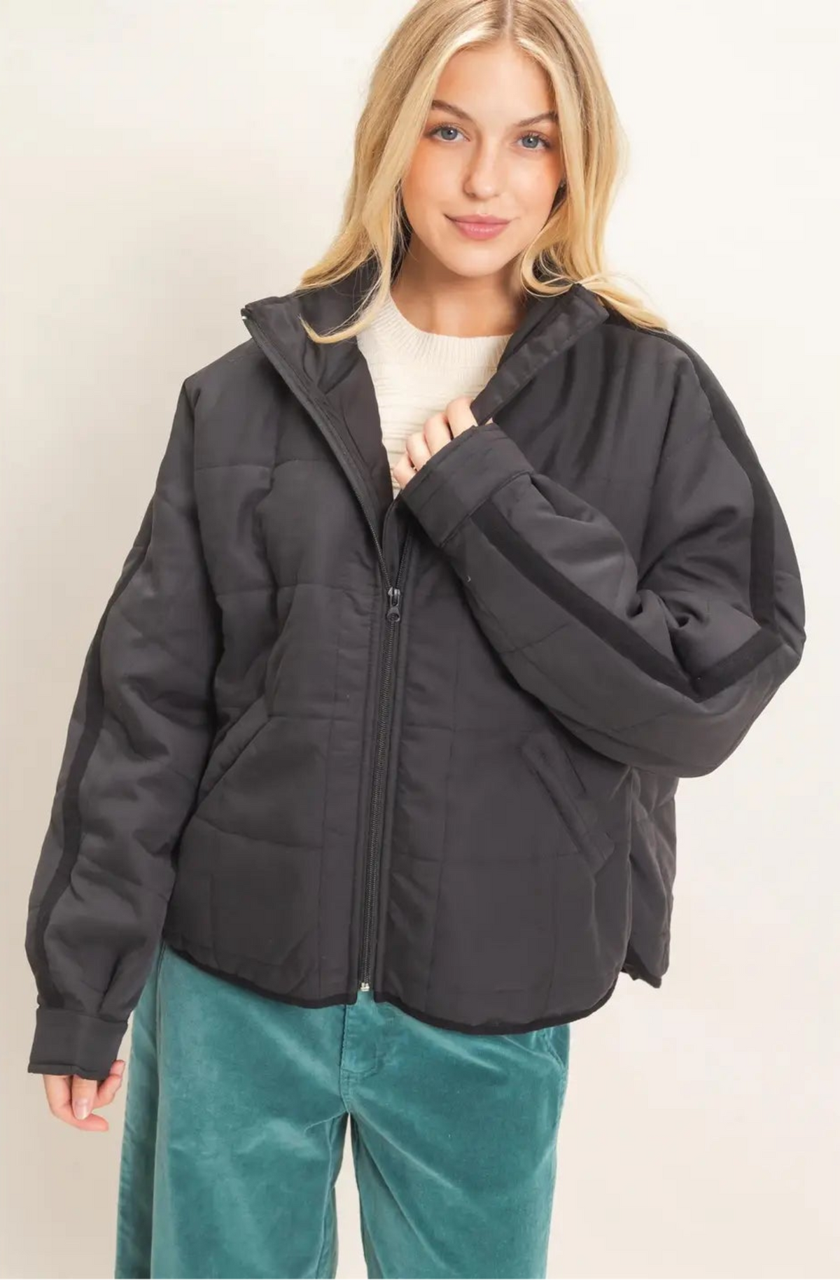Woman wearing black quilted jacket