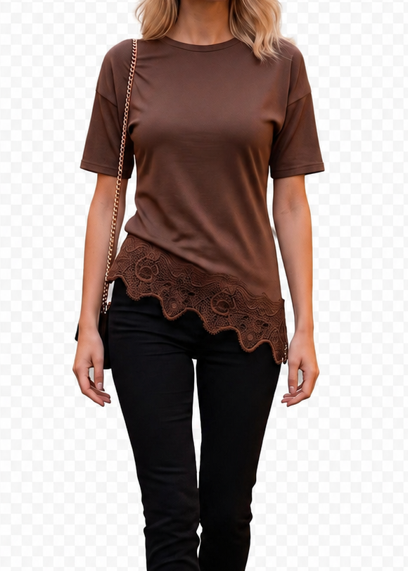 A woman modeling a brown short-sleeve top with a scalloped lace hem, paired with black pants and brown ankle boots, shown against a white background with a faint checkerboard pattern.
